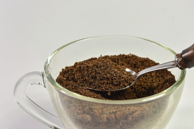 Spoon filled with coffee powder