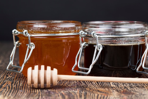 A spoon for honey together with high-quality bee honey