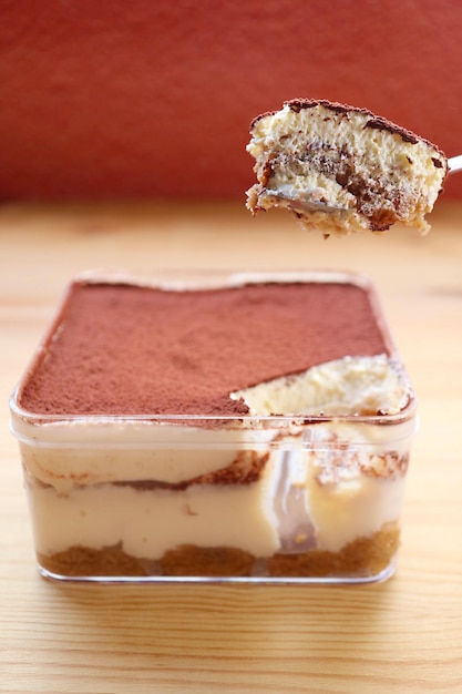 Spoon Scooping Mouthwatering Tiramisu or Tuscan Trifle