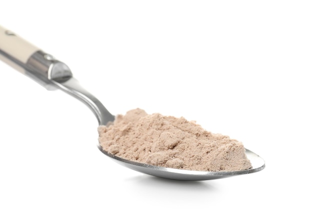 Spoon with protein powder on white background