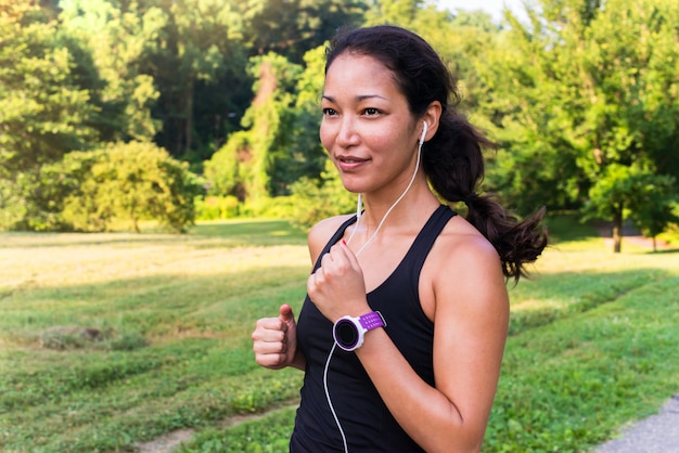 Sport asian woman running outdoors