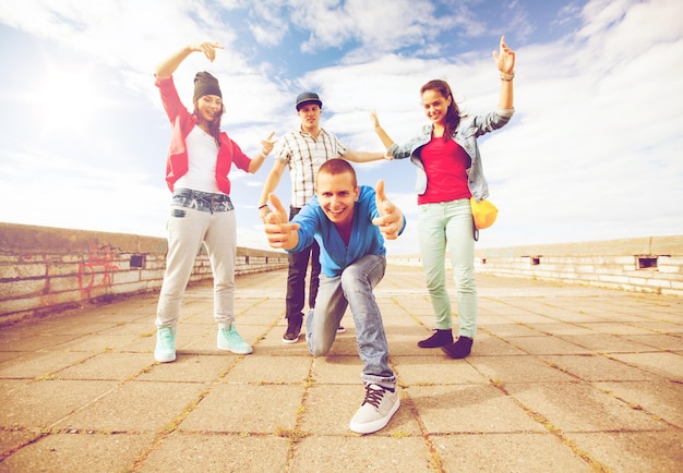 sport, dancing and urban culture concept - group of teenagers dancing