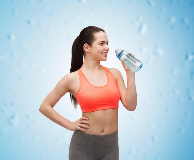 sport, exercise and healthcare - sporty woman with water bottle