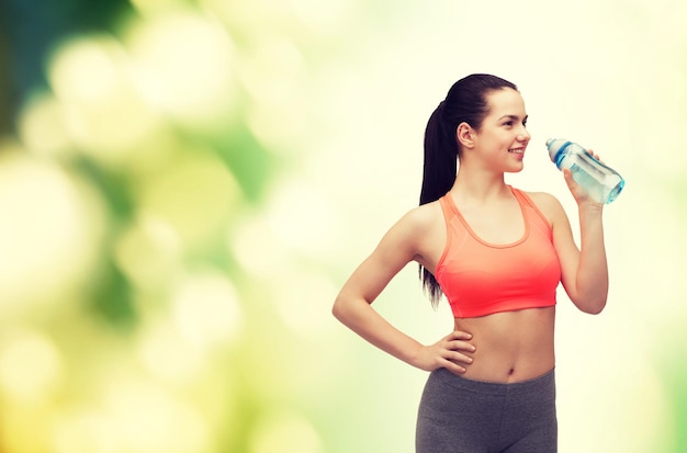 sport, exercise and healthcare - sporty woman with water bottle