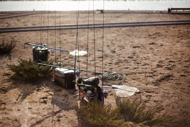 Sport fishing tournament on the lake, fishing boxes and spinning rods on the lake