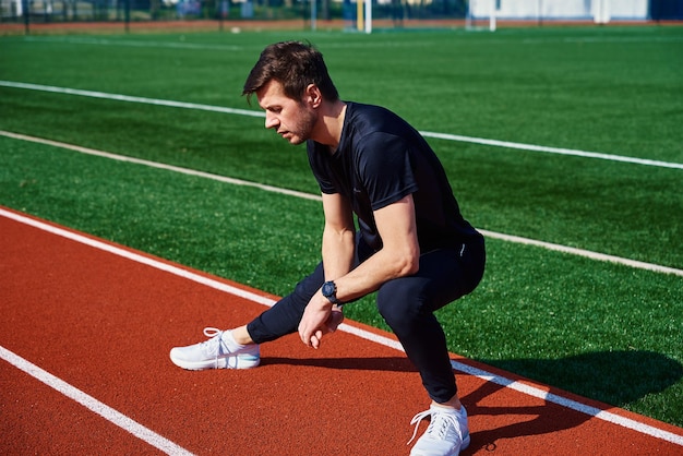 Sport man preparing for jogging outdoors