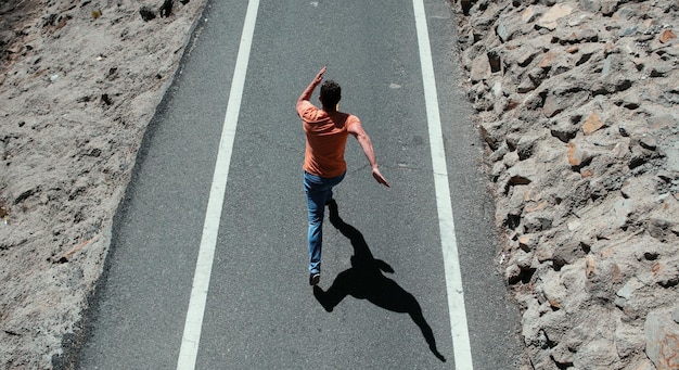 Sport man running sprinting on road fit male fitness runner during outdoor workout with bare torso o