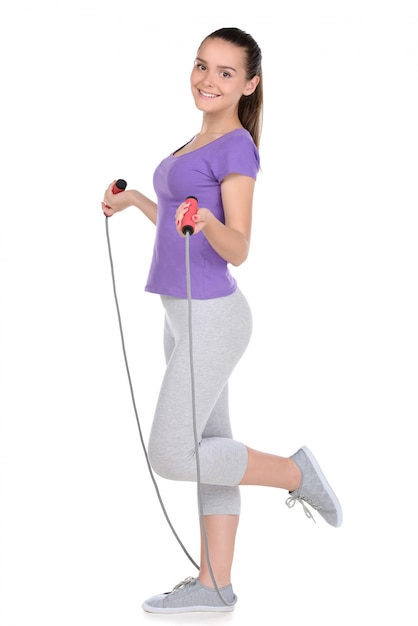 Sport teen woman exercise with rope.