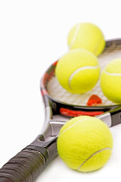 Sport tennis Yellow tennis balls and tennis racket isolated on a white background