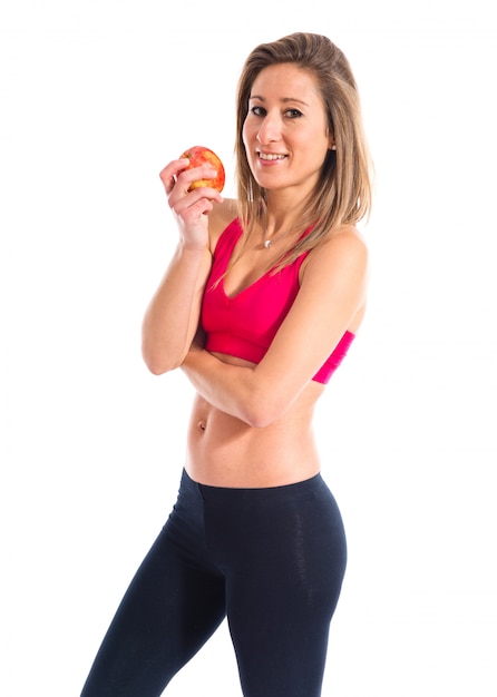 Sport woman holding an apple