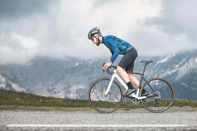 Sporting action of a road cyclist in the highlands