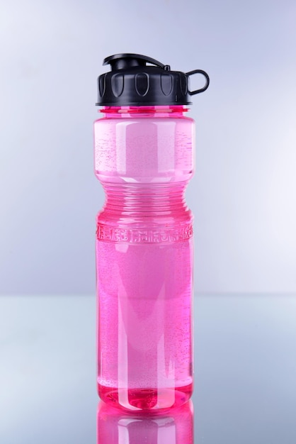 Sports bottle on grey background