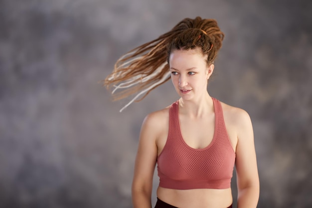 Sports bra on white woman who makes training in gym