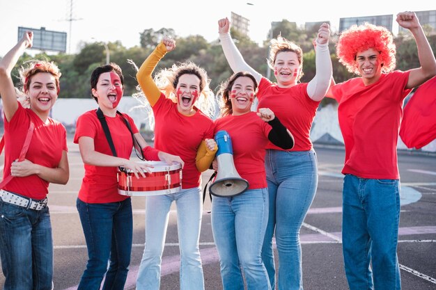 Sports fans together defending their team and cheering for it during the competition Concept fans encourage support