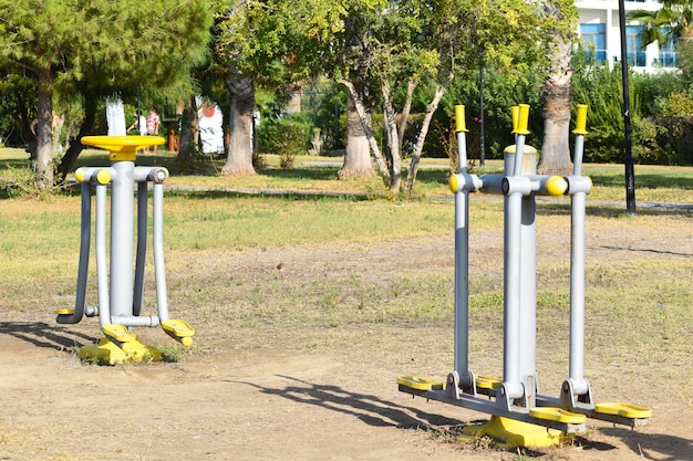 Sports gym kit outside on the lawn. outdoor public park trainer