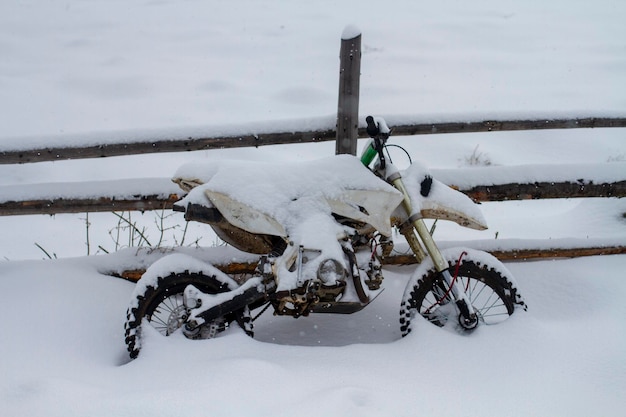 Sports motorcycle covered with snow