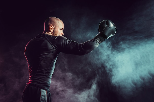 Sportsman boxer fighting with smoke