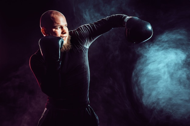 Sportsman boxer fighting with smoke