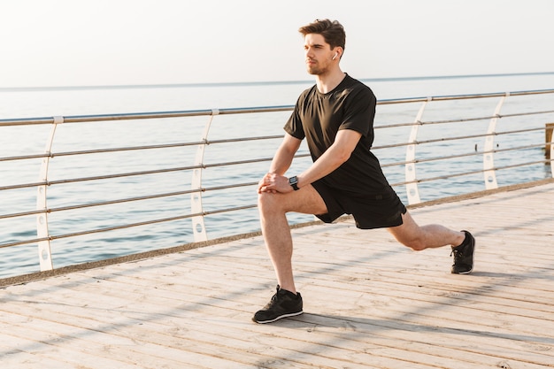 Sportsman doing sport exercises outdoors