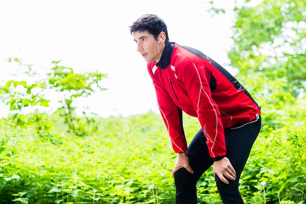 Sportsman having break from running