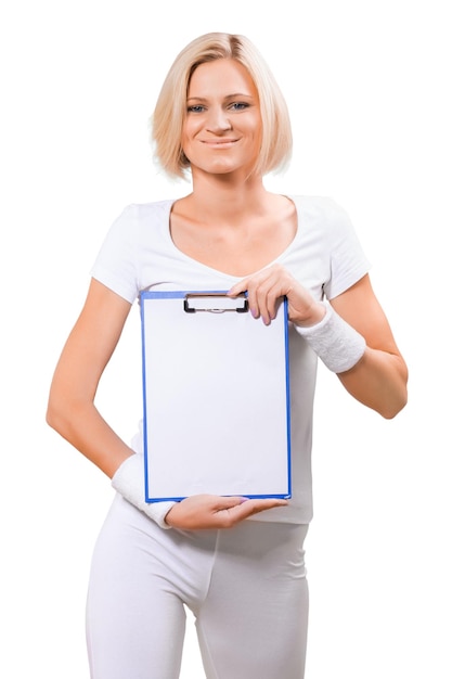 A sportswoman holding clipboard with empty sheet isolated