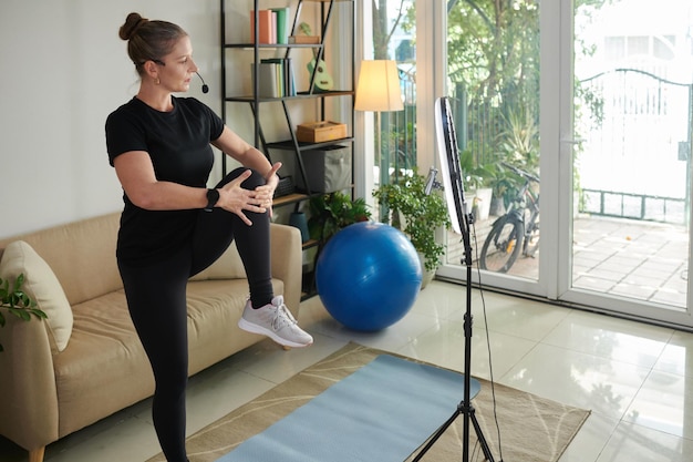 Sportswoman Recording Herself Working out