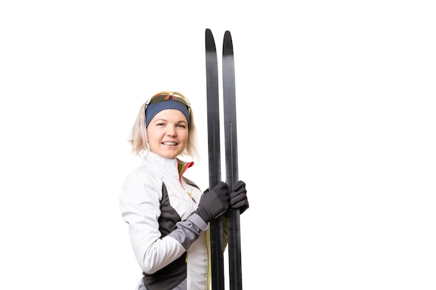 Sportswoman with skis on empty white background