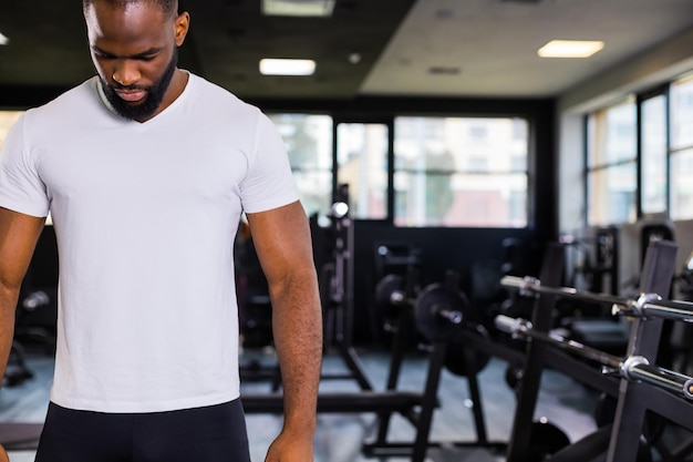 Sporty african man resting having break after doing exercise