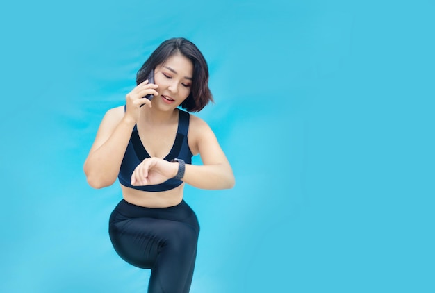 Sporty asian woman on isolated background