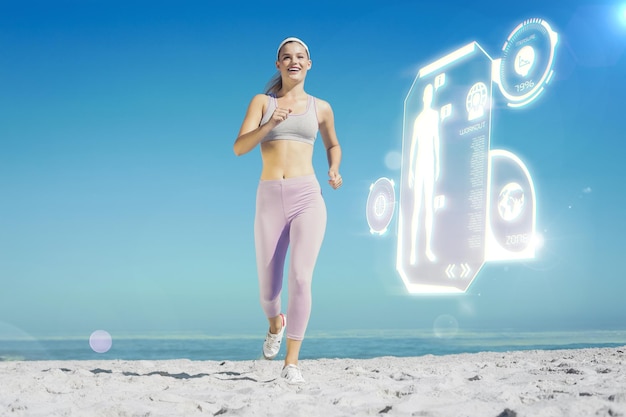 Photo sporty blonde on the beach jogging towards camera against fitness interface