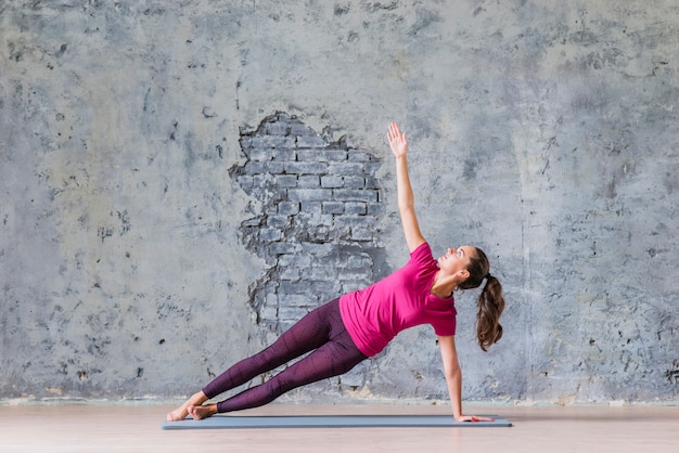 Sporty fitness young woman doing yoga practice