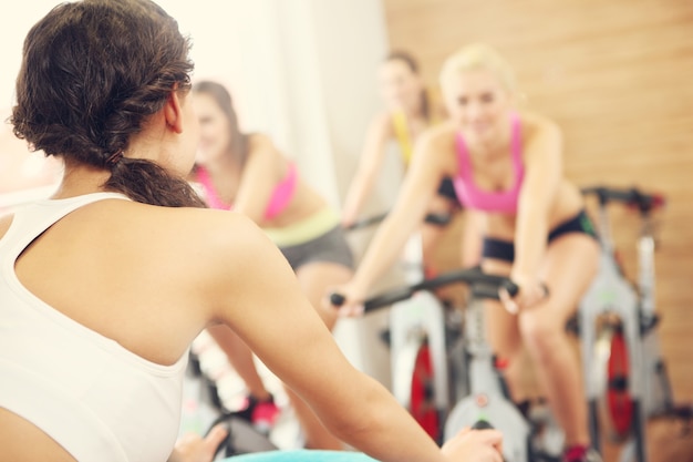 sporty group of women on spinning class