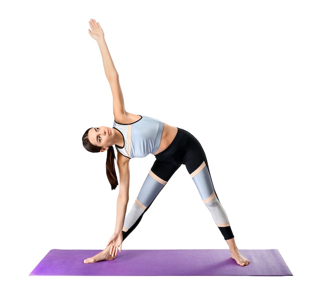 Sporty woman practicing yoga on white background