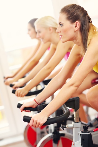 sporty women group on spinning class