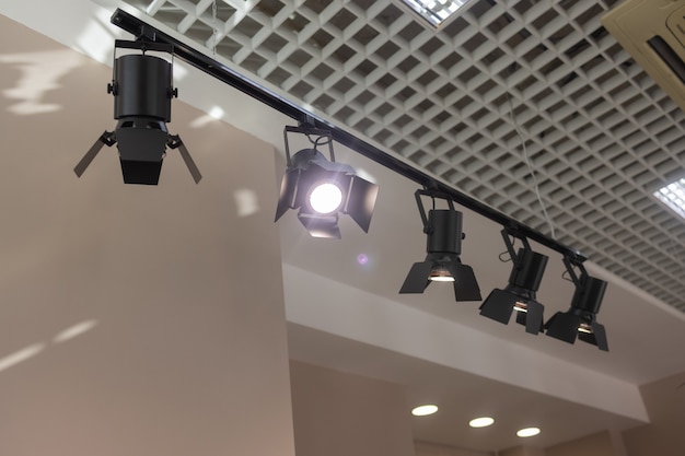 Photo spotlights under the ceiling on the wall. track led-lighting system.