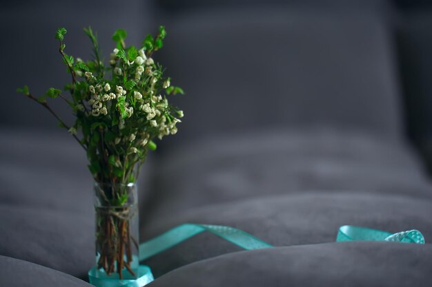 spring bouquet branches bud leaves / small fresh branches in a bouquet with green leaves buds and flowers, spring