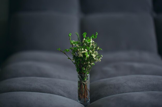 spring bouquet branches bud leaves / small fresh branches in a bouquet with green leaves buds and flowers, spring