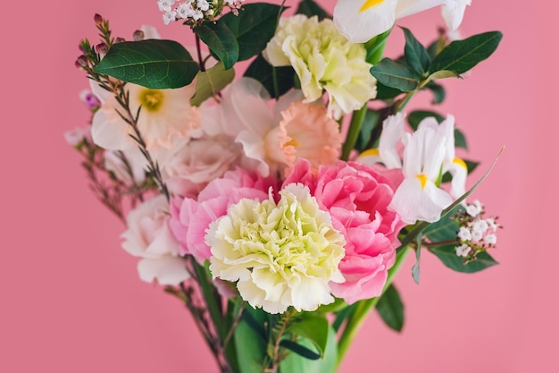 Spring bouquet for the holiday on a pink background closeup