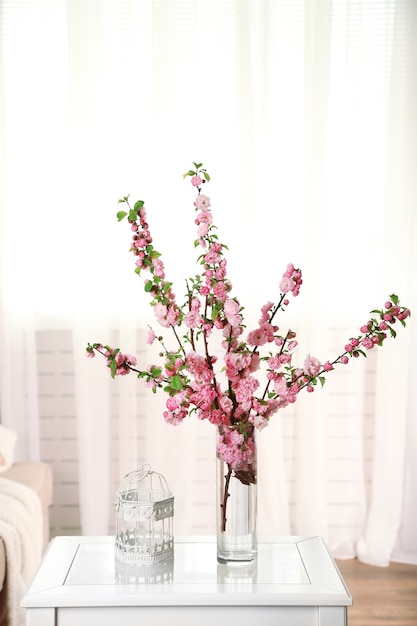 Spring bouquet in vase, on table, on home interior space