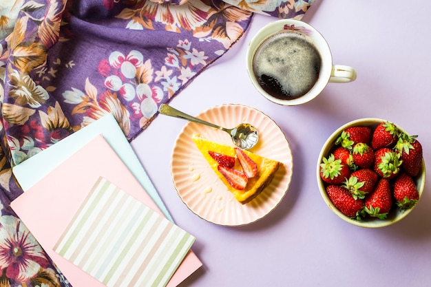 Spring breakfast with cheesecake, coffee and strawberries 