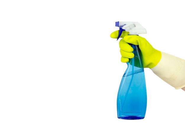 Spring cleaning concept.Top view of hand in yellow rubber gloves holding Blue Spray Bottle.Cleaning concept, cleaning service.