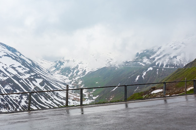 Spring cloudy overcast mountain landscape (Oberalp Pass, Switzerland)