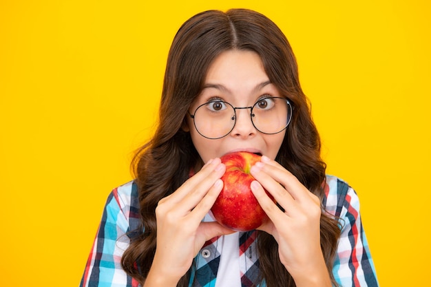 Spring everywhere spring season fruits full of vitamins organic food only natural and healthy happy childhood kid eat apple child with fruit Shocked surprised teenager girl