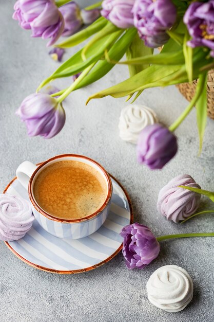 Spring Flat lay with coffee, bouquet of tulips and marshmallows