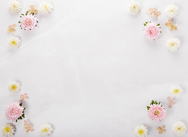 Spring frame of small flowers and daisy floral arrangement