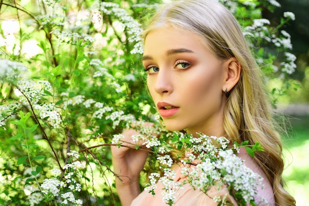 Spring girl face. girl in white blossom