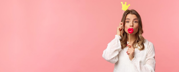 Spring happiness and celebration concept closeup portrait of funny and cute silly blond girl in whit