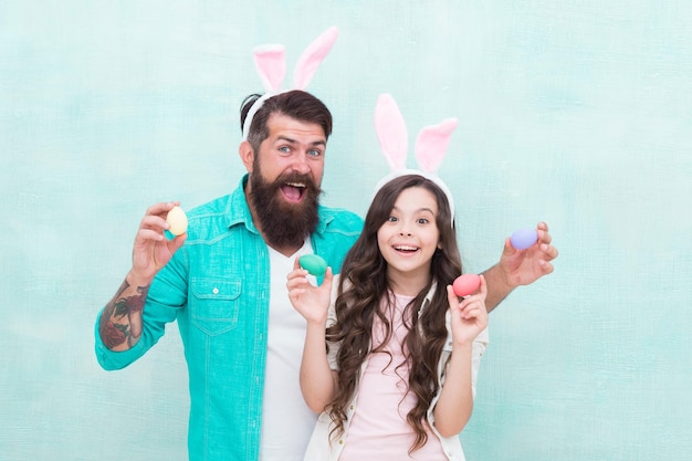 Spring holiday Easter activities for family Family tradition concept Dad and daughter bunny ears Fun ideas Sale and discount Traditional food Happy easter Father and child celebrate easter