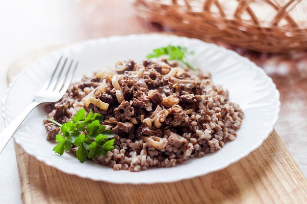 Spring Morel mushrooms stewed in sour cream served with buckwheat