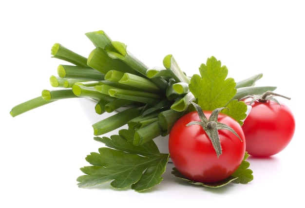 Spring onions and cherry tomato in bowl